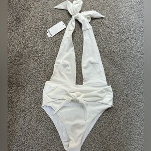 Bought bathing suit for my honeymoon. Too small. Never worn. Tags attached